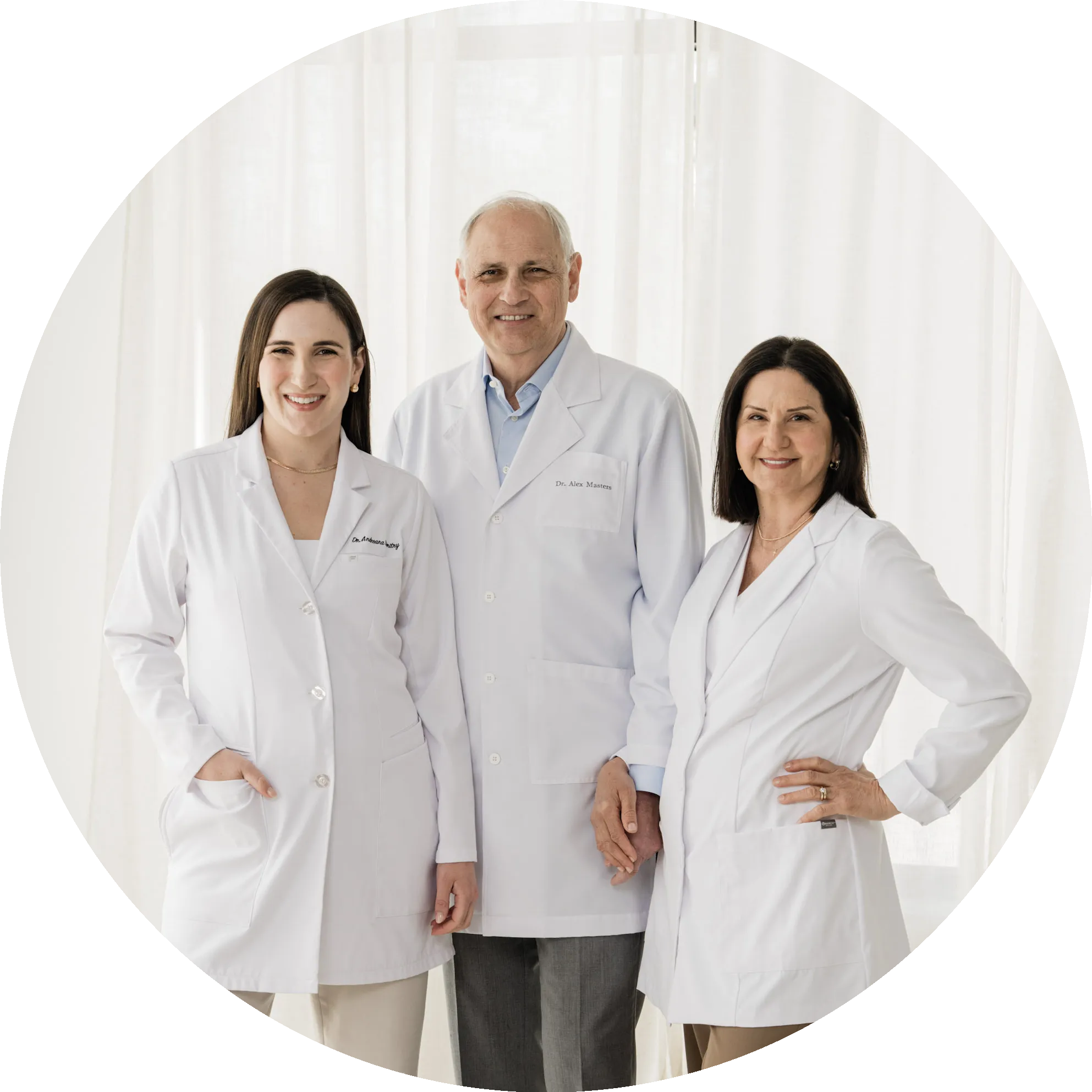 Circular portrait of the three Masters Family Dentistry doctors in white coats