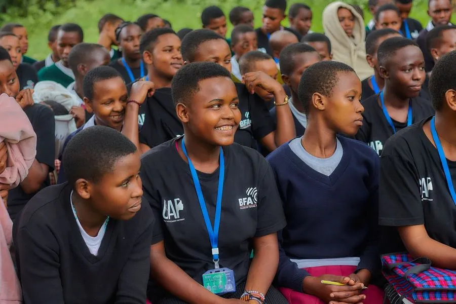 Elizabeth smiling, seated with her cohort