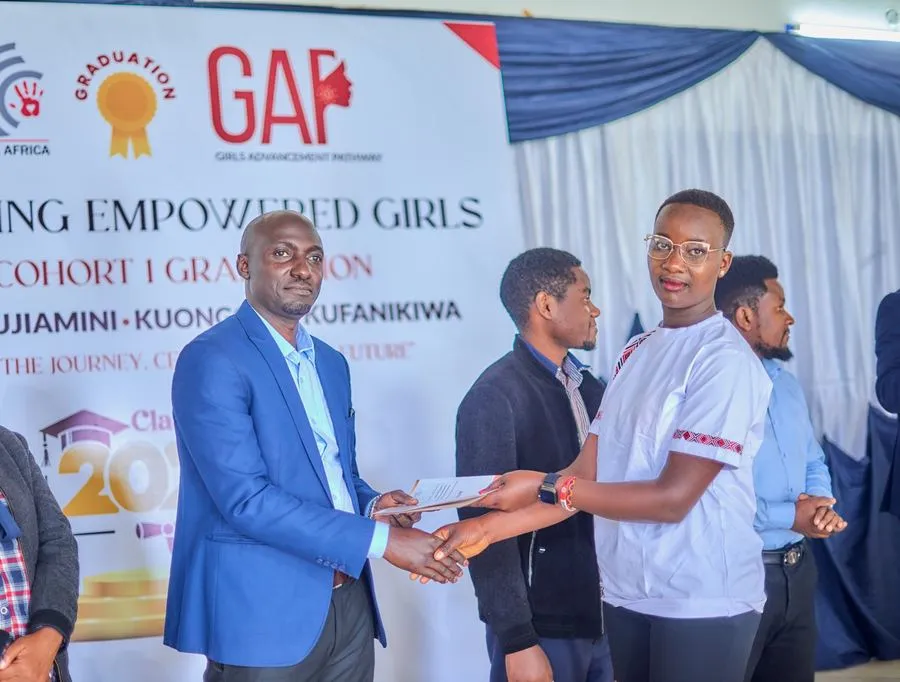 Jackline receiving her GAP certificate at graduation
