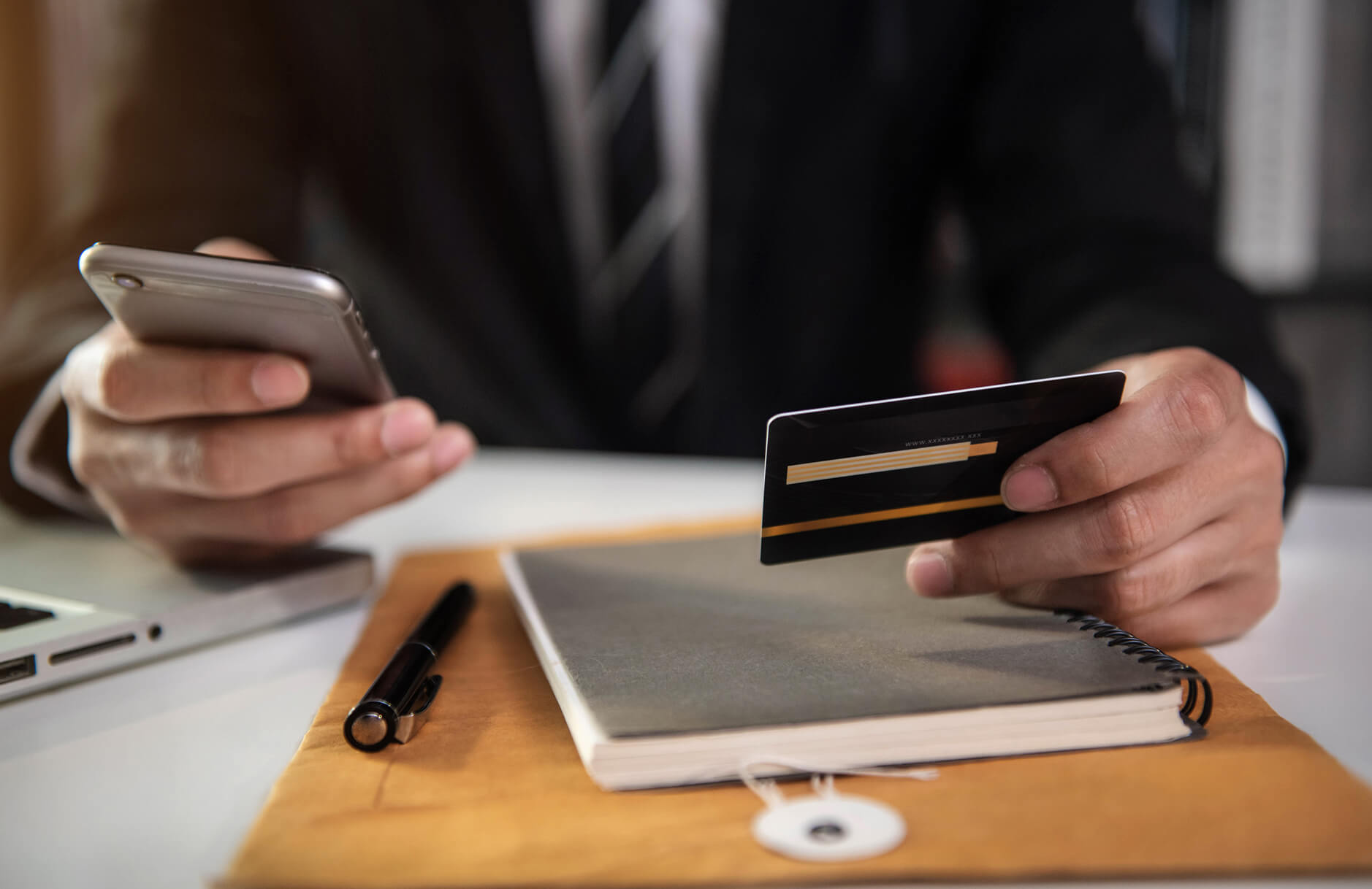 man paying via credit card