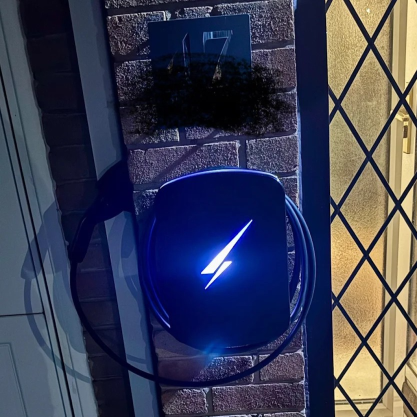 hypervolt ev charger installation lit up at night