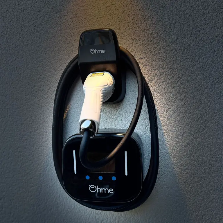 ohme home ev charger installed under light