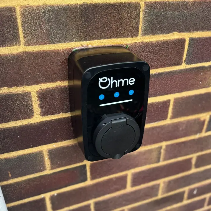 ohme home ev charger installed under light