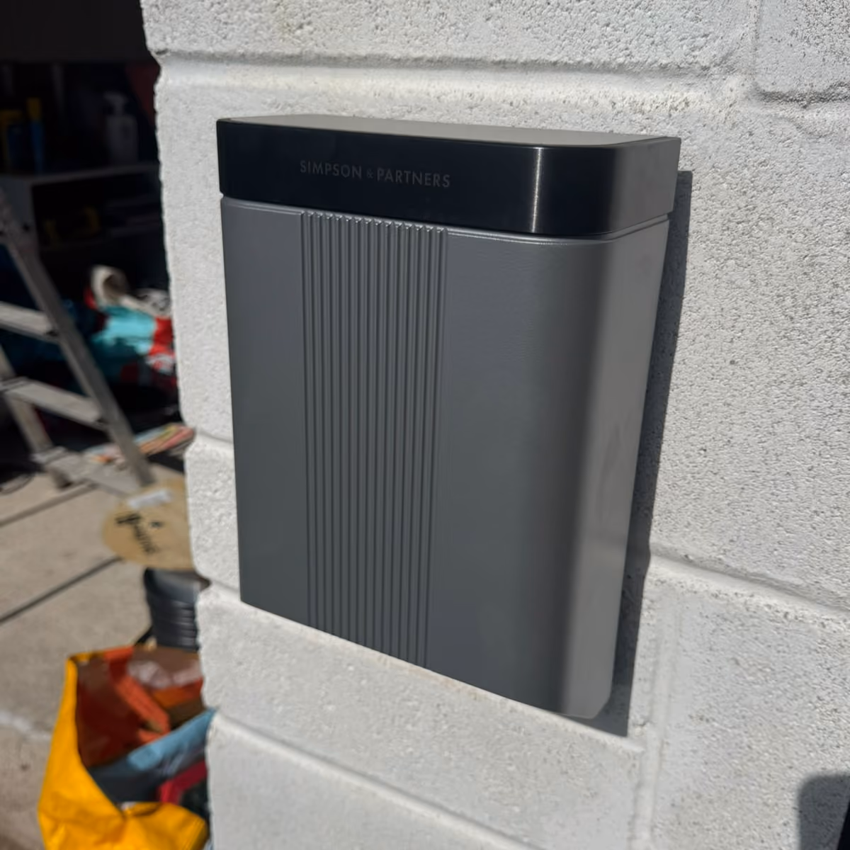 ohme home ev charger installed under light