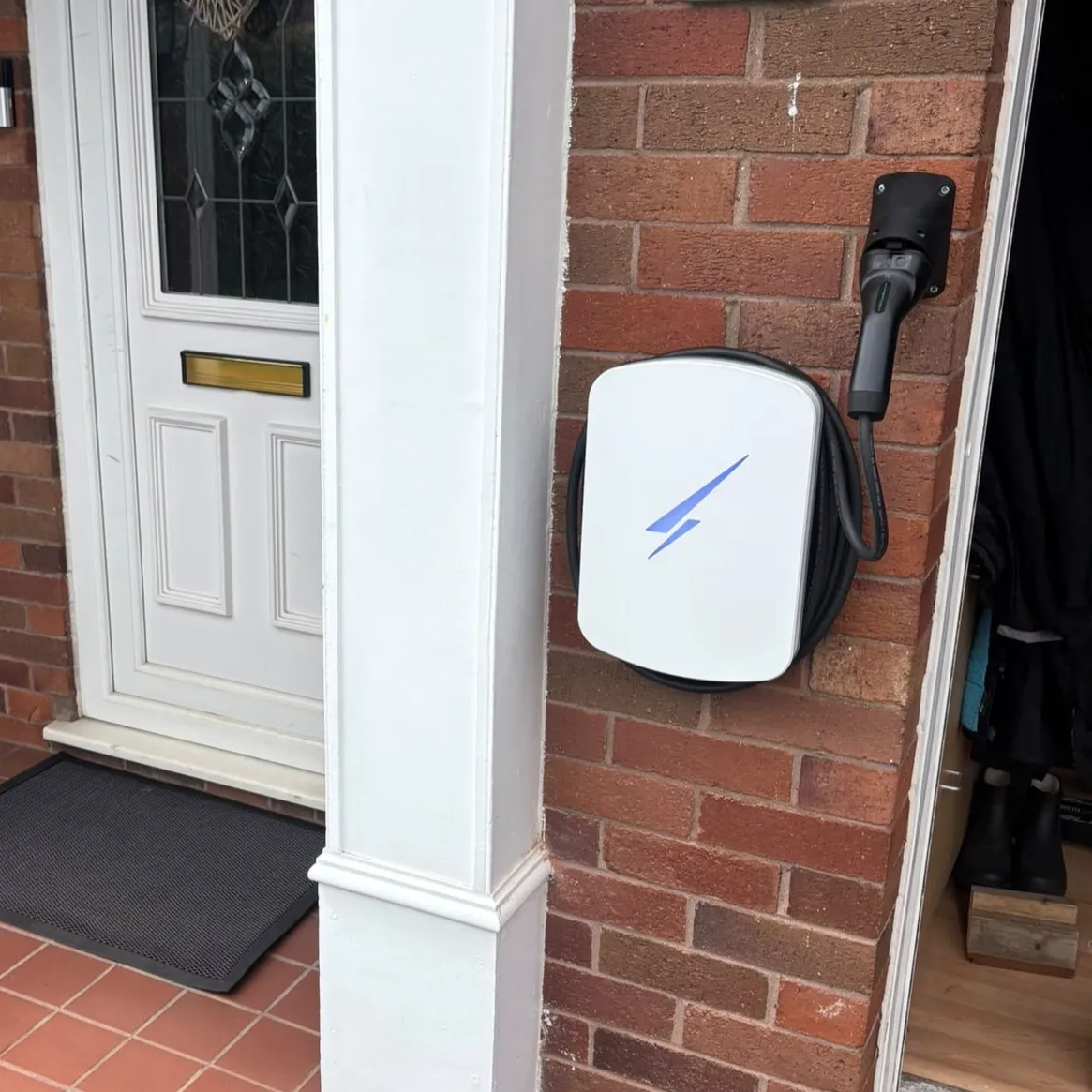 ohme home ev charger installed under light