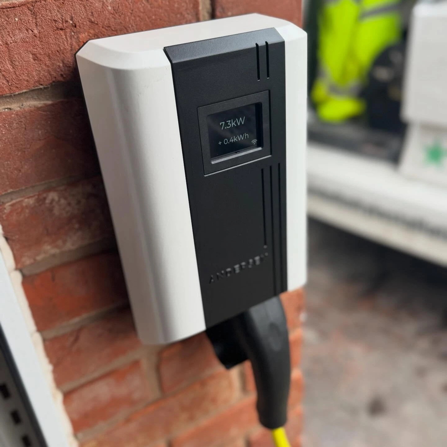 ohme home ev charger installed under light