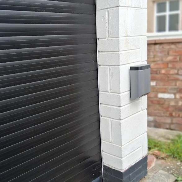ohme home ev charger installed under light