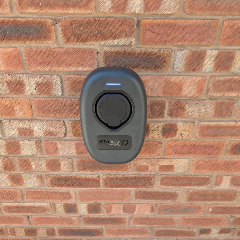 ohme home ev charger installed under light