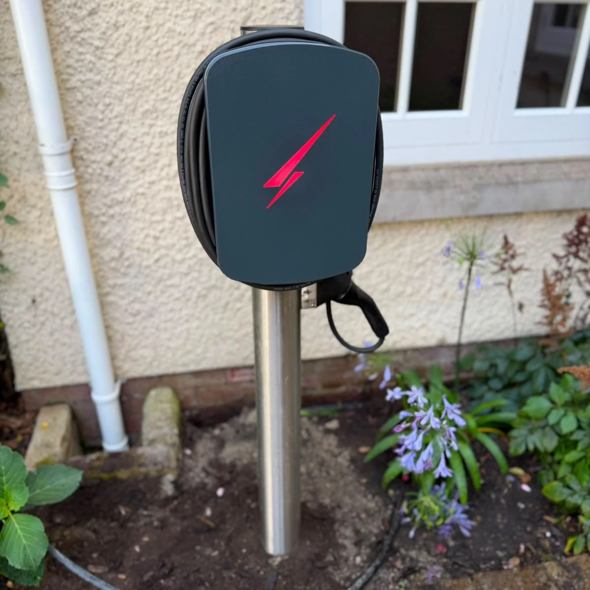 ohme home ev charger installed under light
