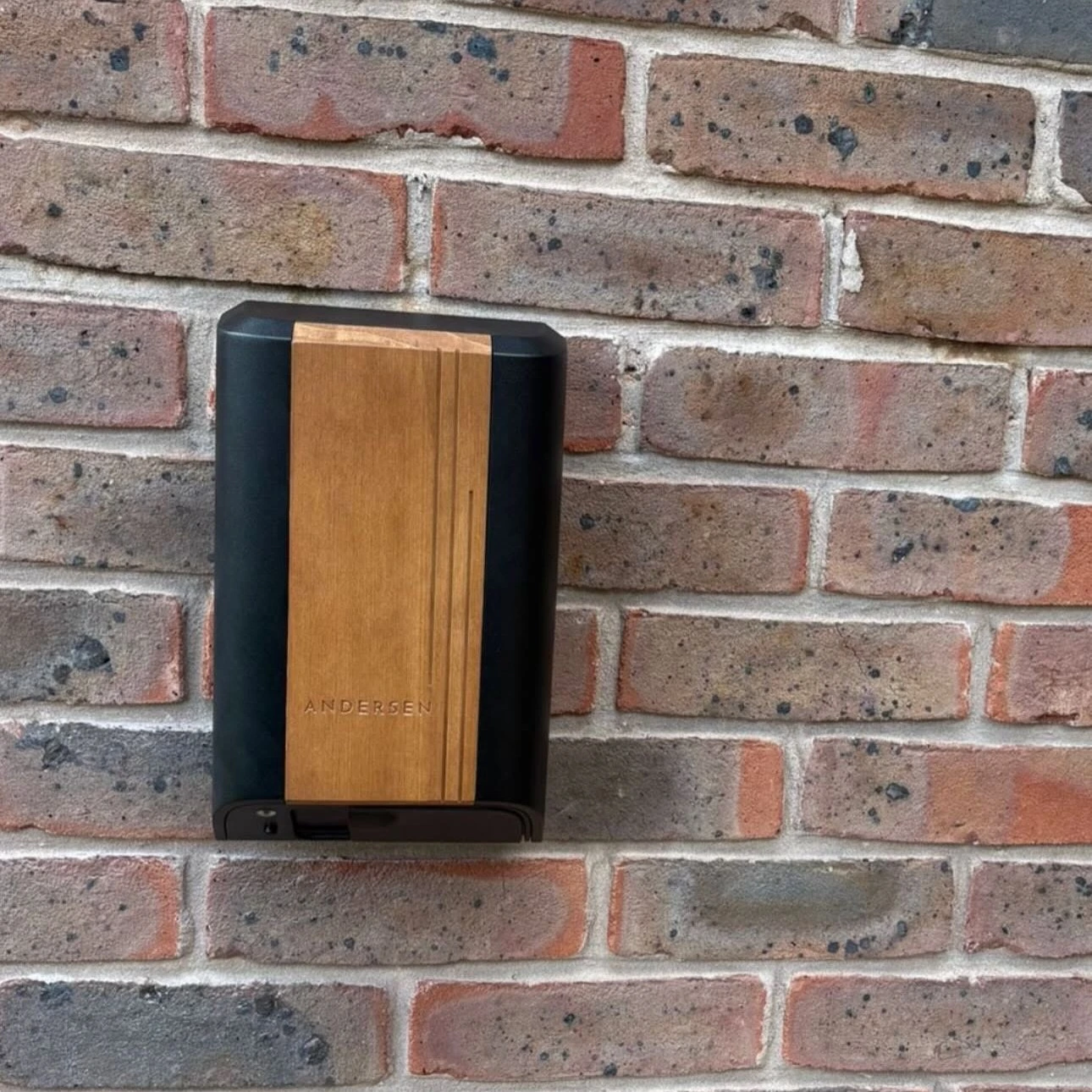 ohme home ev charger installed under light