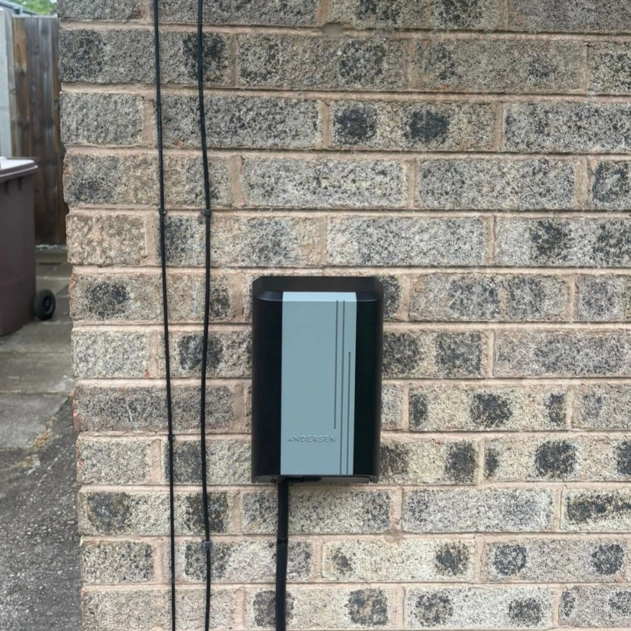 ohme home ev charger installed under light