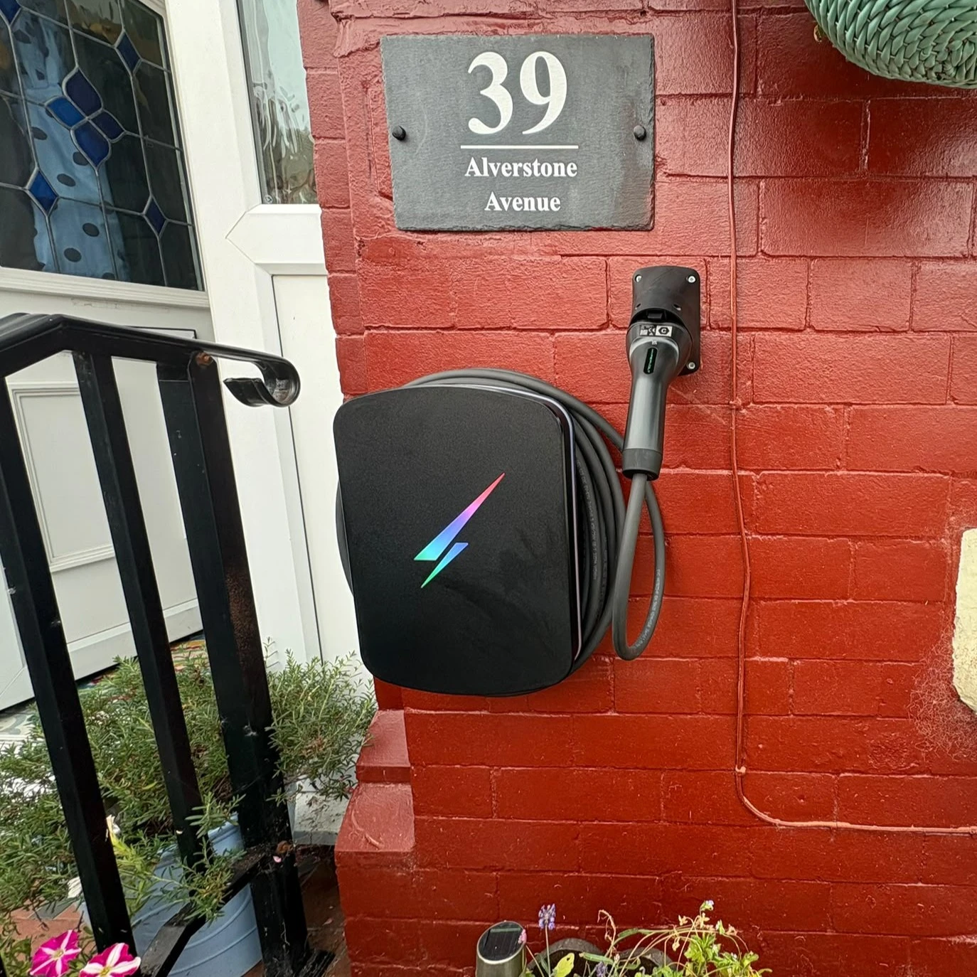 ohme home ev charger installed under light
