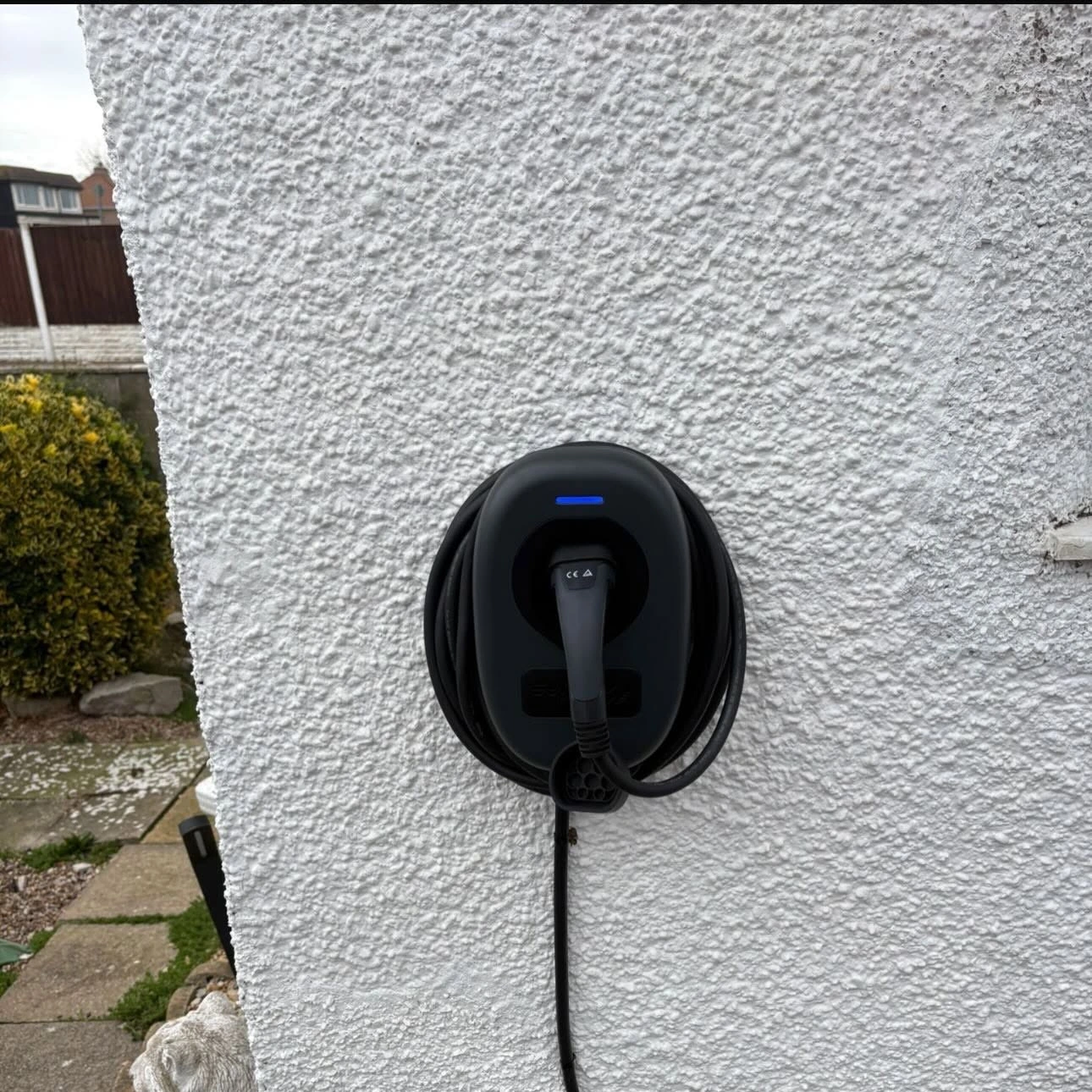 ohme home ev charger installed under light