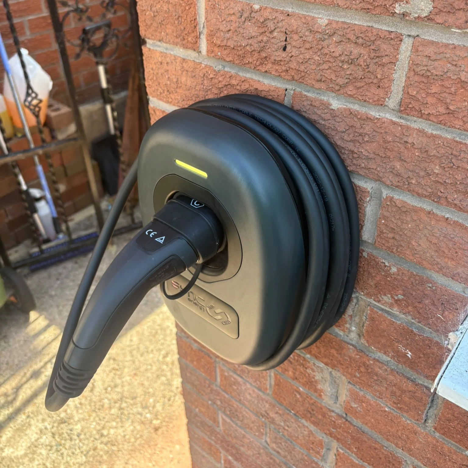 ohme home ev charger installed under light