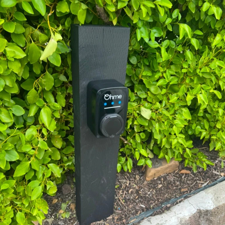 ohme home ev charger installed under light
