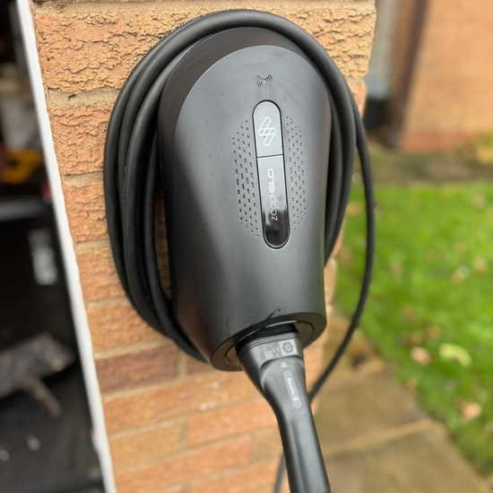 Zappi home EV charger installed on a garage pillar