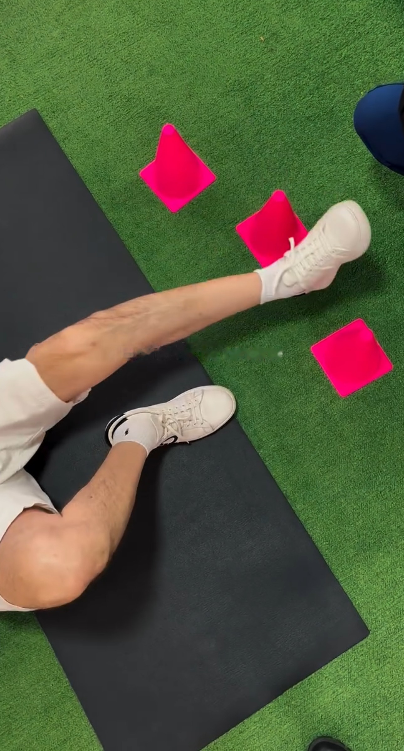 Regenerative therapy patient stretching with resistance protocol on turf