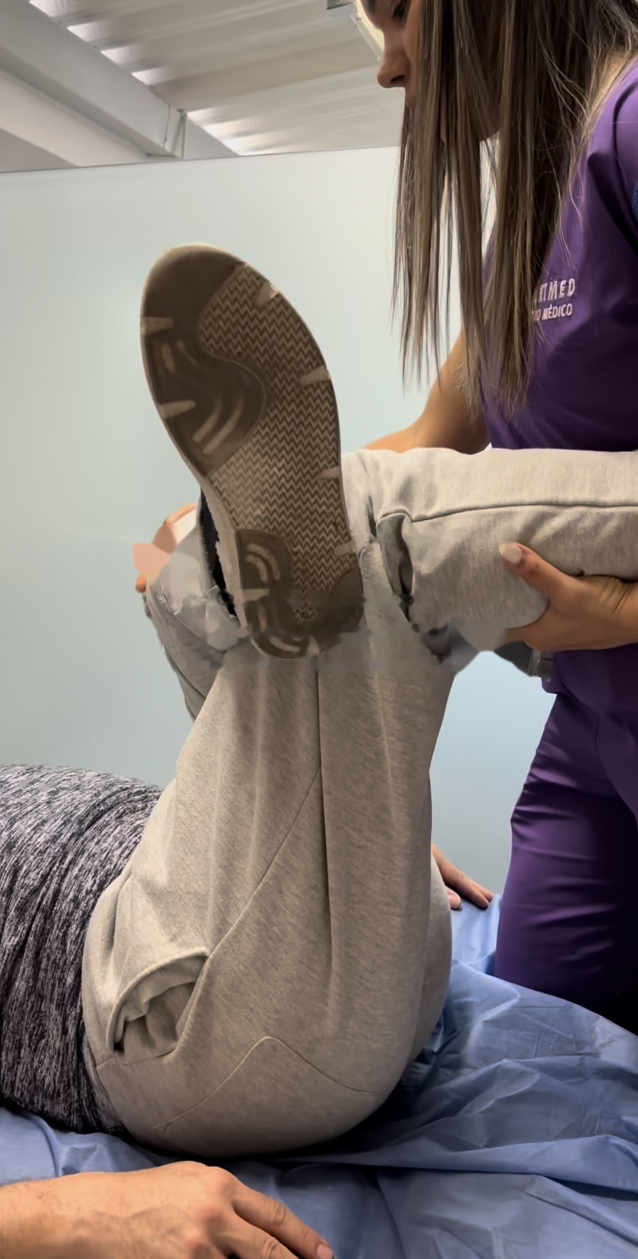 SportMed therapist guiding longevity medicine mobility protocol