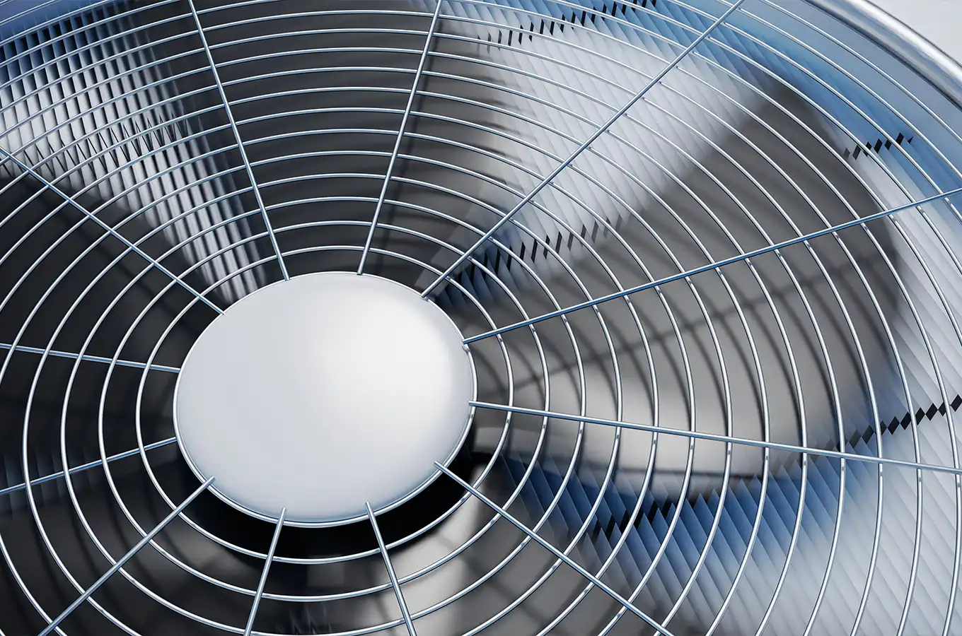 View of the fan blades on a residential HVAC unit