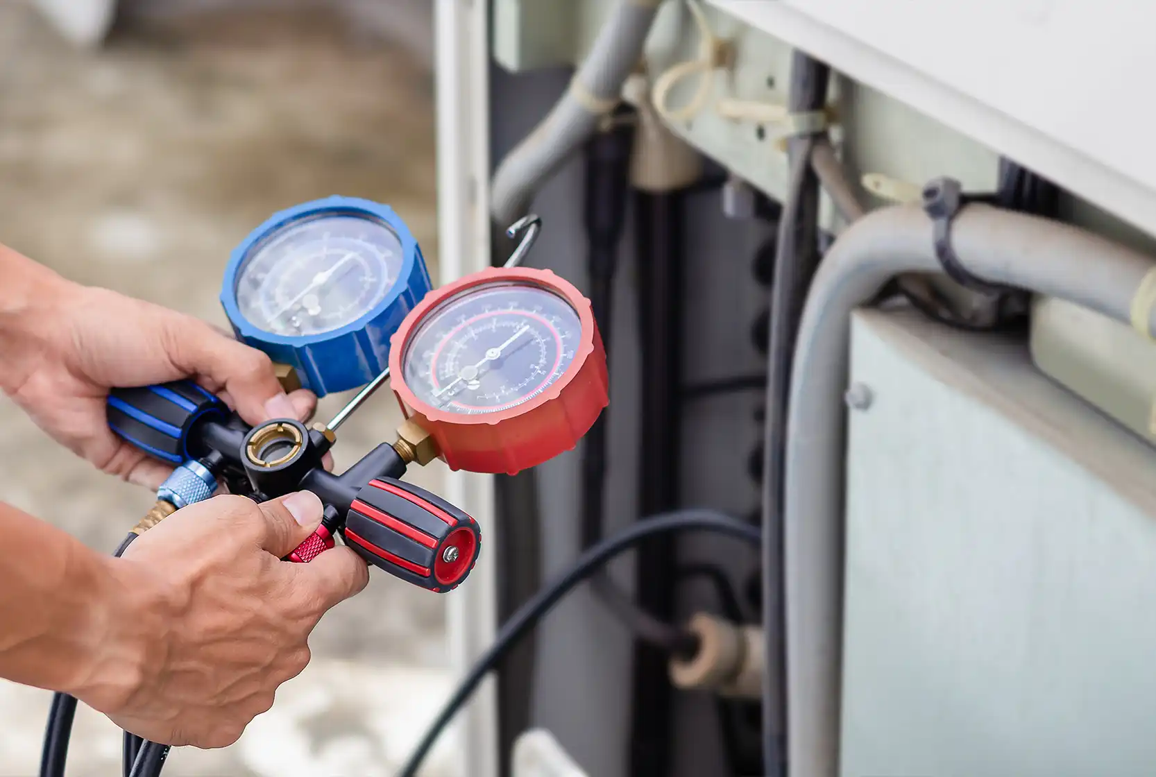 Technician holding HVAC maintenance equipment in his hands