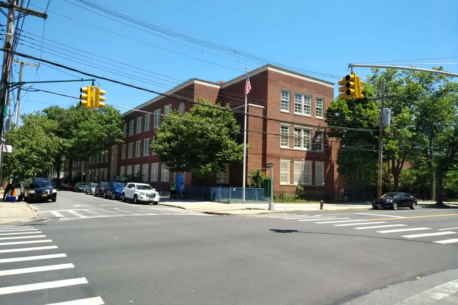 Exterior view of PS 251 red brick school building at street corner