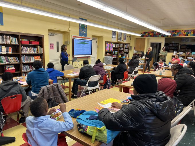Families and students attend a school library presentation evening