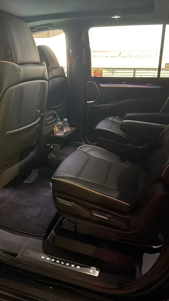 Second-row leather captain's chairs inside a GeronimoLux Cadillac Escalade ESV