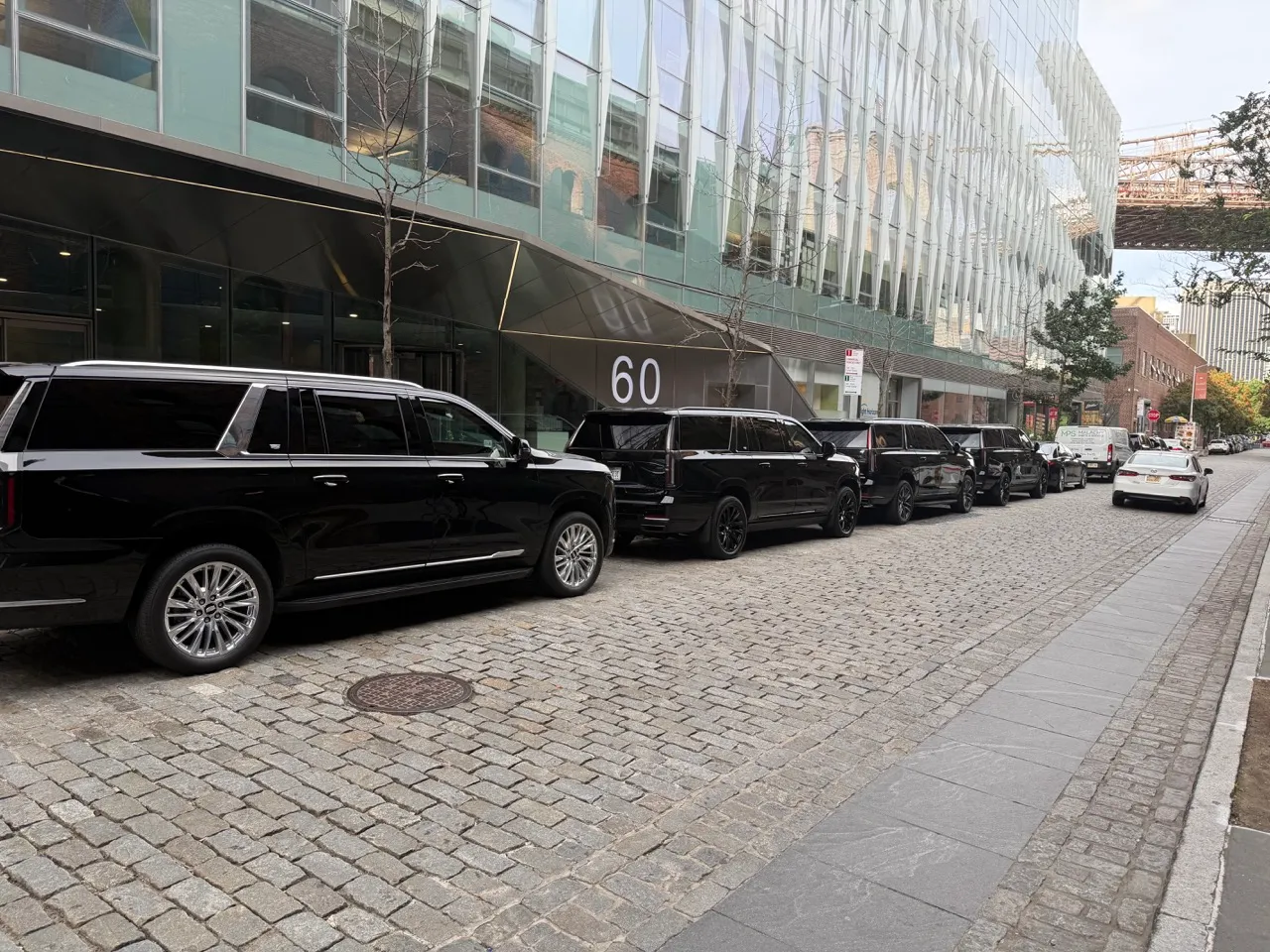 GeronimoLux Chevrolet Suburban and Cadillac Escalade ESV SUVs lined up on a New York City street