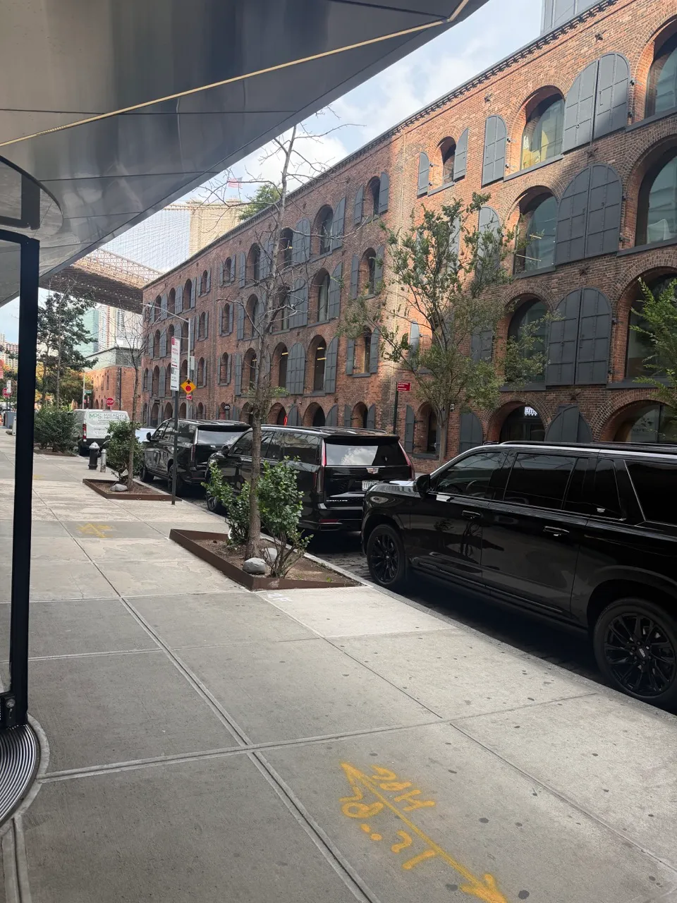 GeronimoLux Cadillac Escalade parked curbside in New York City for a LaGuardia Airport pickup