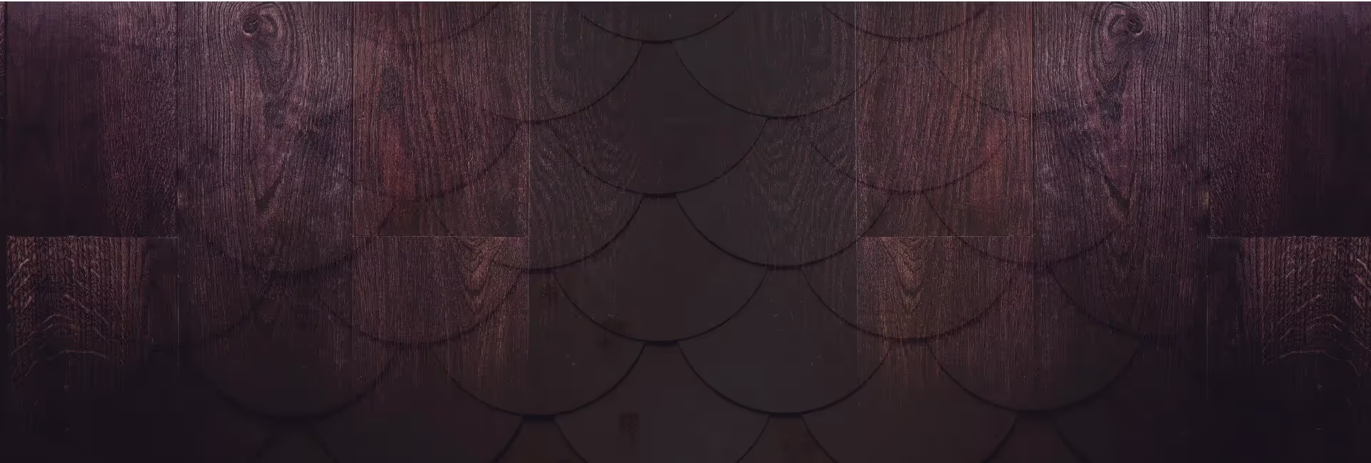 Dark wood wall with scale pattern, adding texture and depth to the room's decor.