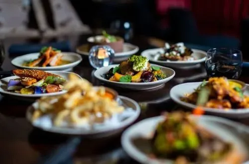 An assortment of dishes on a table ready to be enjoyed.