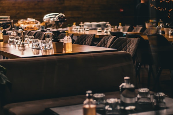 a restaurant filled with lots of tables and chairs