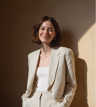 A professionally dressed woman representing trust, expertise, and strong leadership in architectural project management.