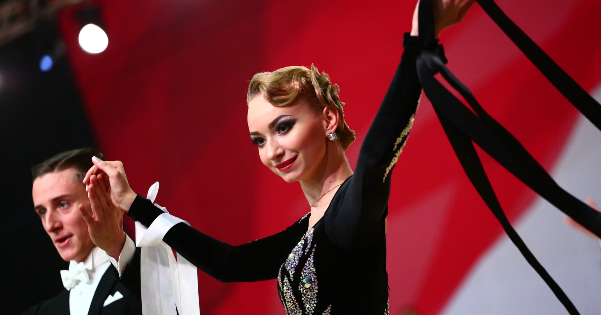 a man and a woman standing on stage