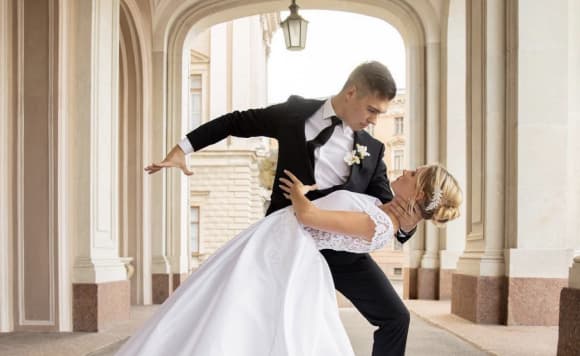 a man and a woman doing a wedding dance