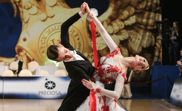 a man and a woman ballroom dancing