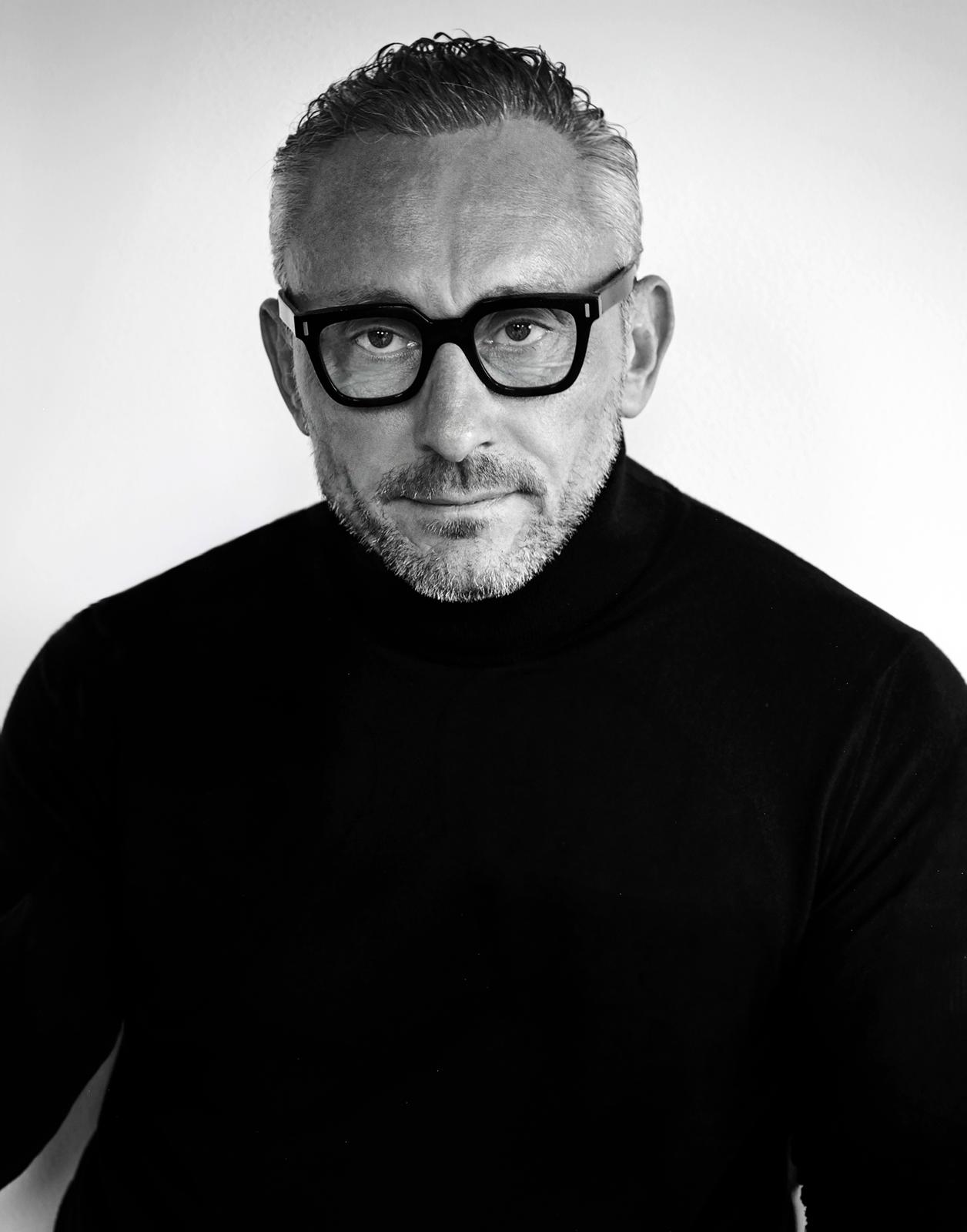 Black-and-white portrait of Mr. Igor Kucherenko, Chairman of Premier Casino Group.