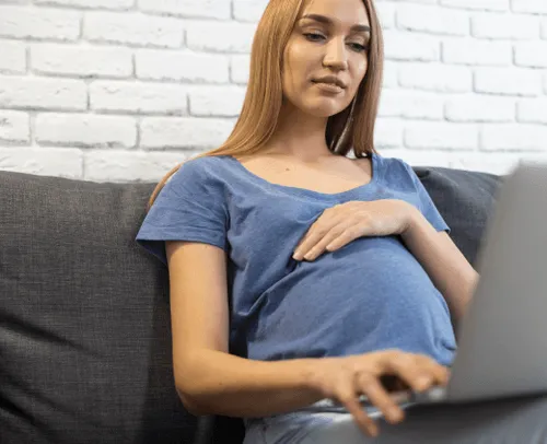 pregnant woman holding her belly