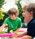 Two boys playing outside