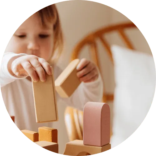 Child playing with wooden blocks