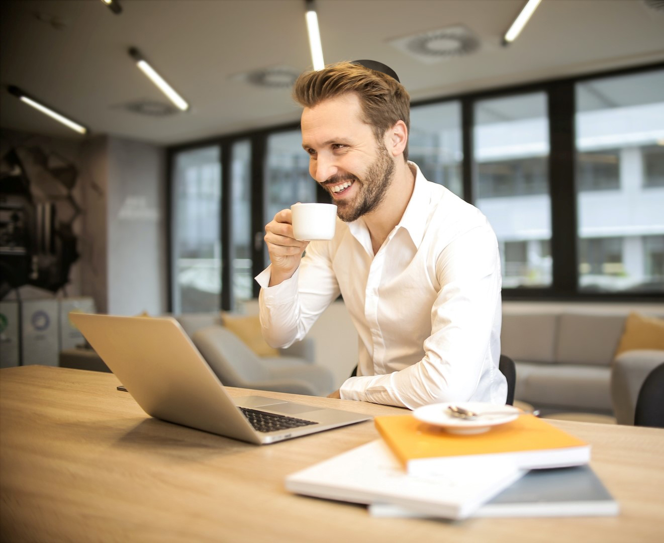 Depth of field photo of a happy business man looking at his personalized tax saving strategy.