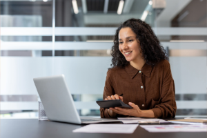 Happy bookkeeper giving financial clarity to construction companies.