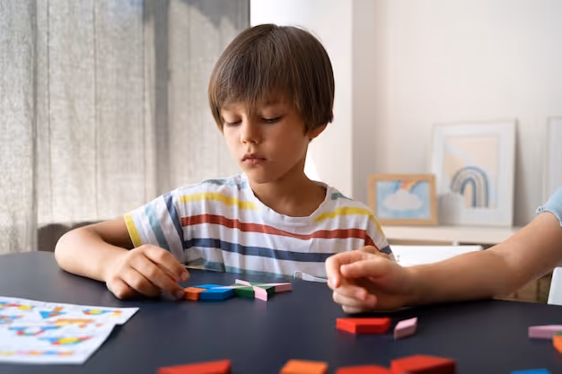 Front view kid making puzzle on table