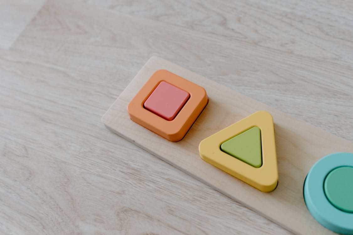 Free Colorful Educational Toy on a Wooden Surface Stock Photo