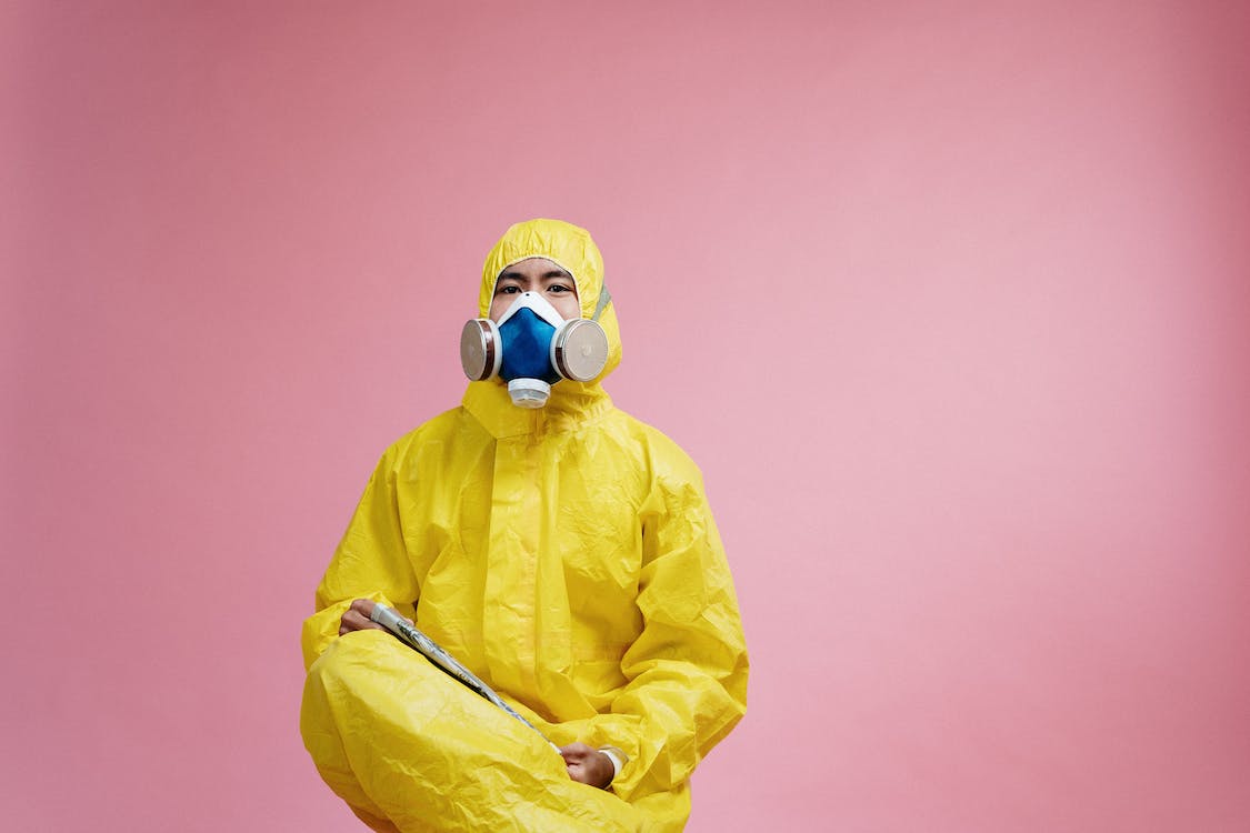 Free Person Wearing Yellow Protective Suit Stock Photo