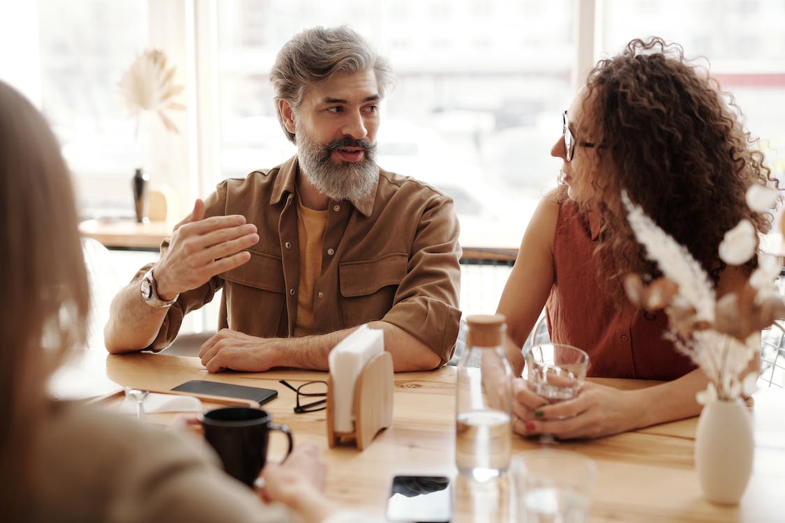 Free A Man and Woman Talking Together  Stock Photo