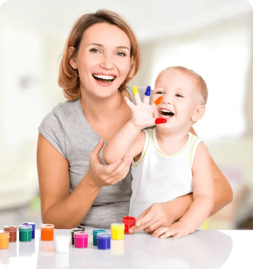 Little boy playing blocks with mom