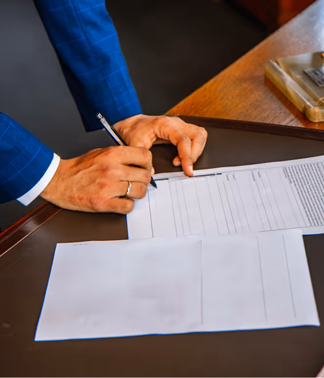 a man signs a contract