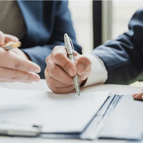 a man signs a contract