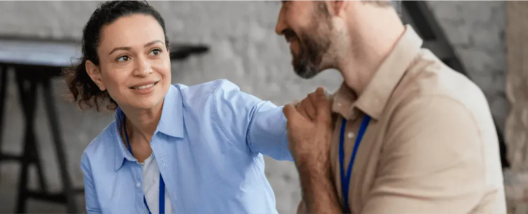 Woman smiling at man transmitting hope